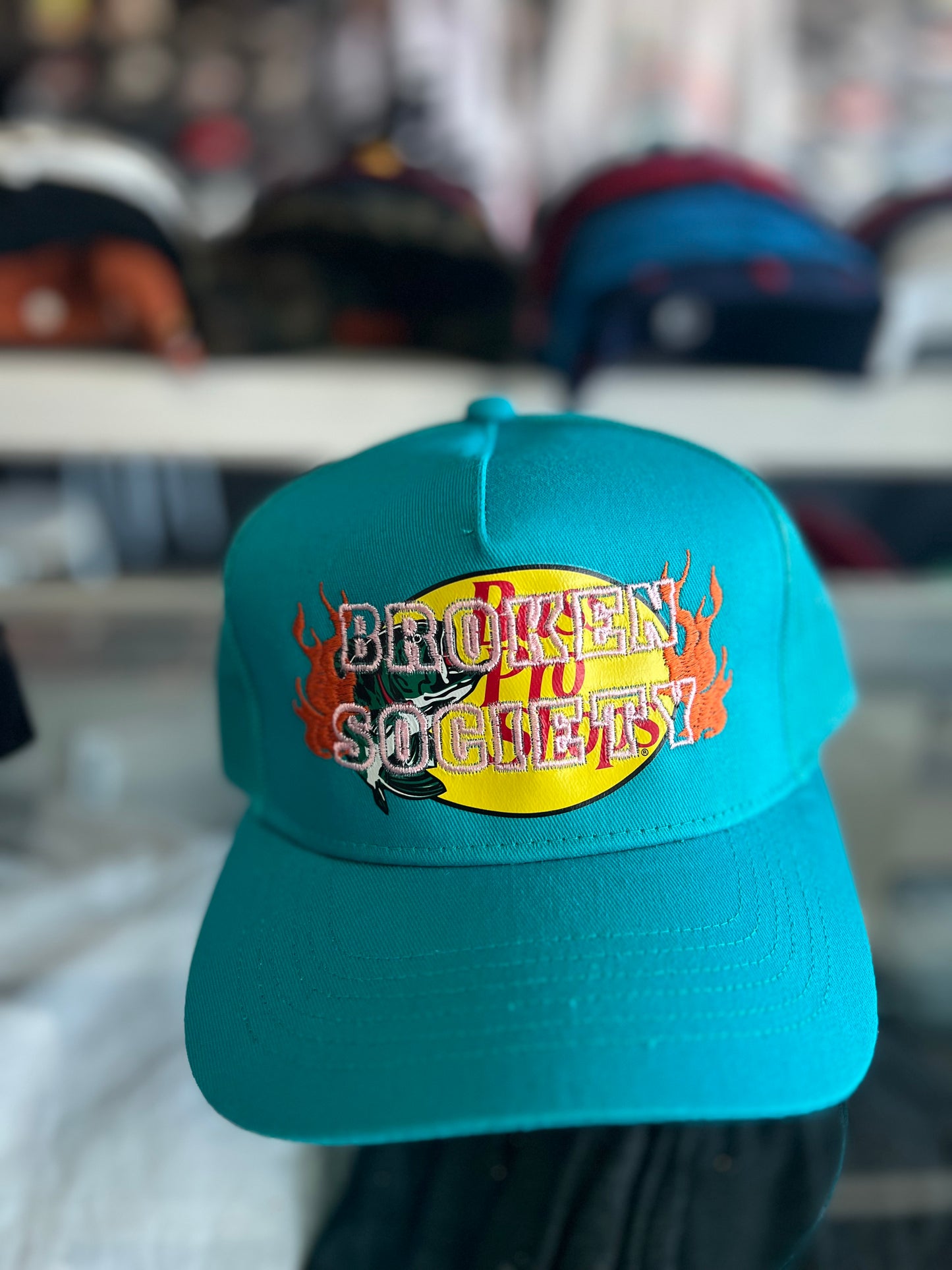 Teal bass pro shop trucker